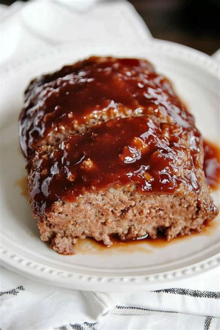 Brown sugar glaze being poured over a pineapple cake