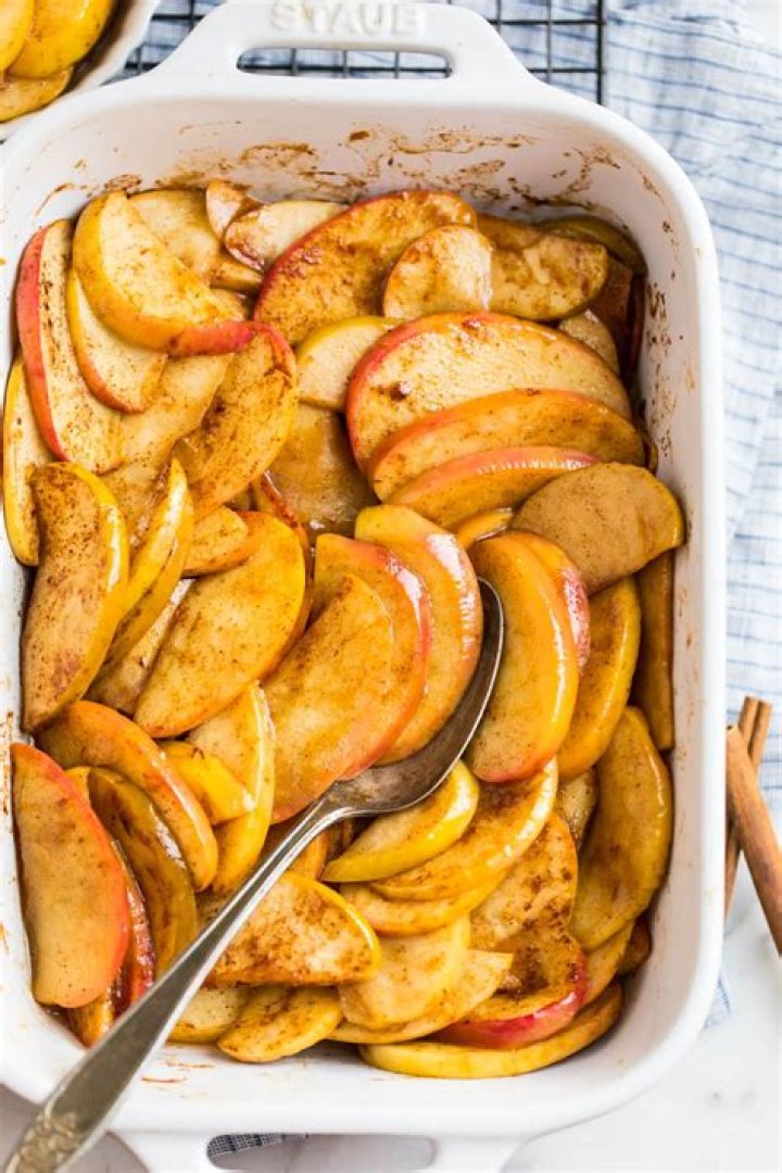Cinnamon Apples in a white baking dish.