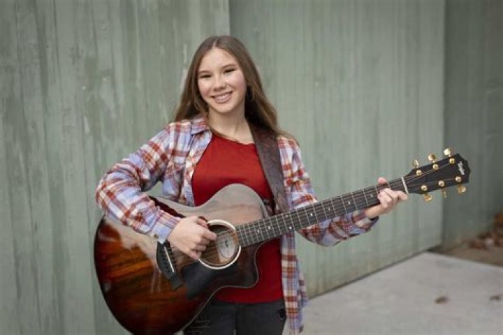Herself - Singer / Guitarist