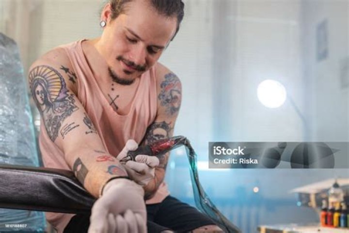 Himself, tattoo artist