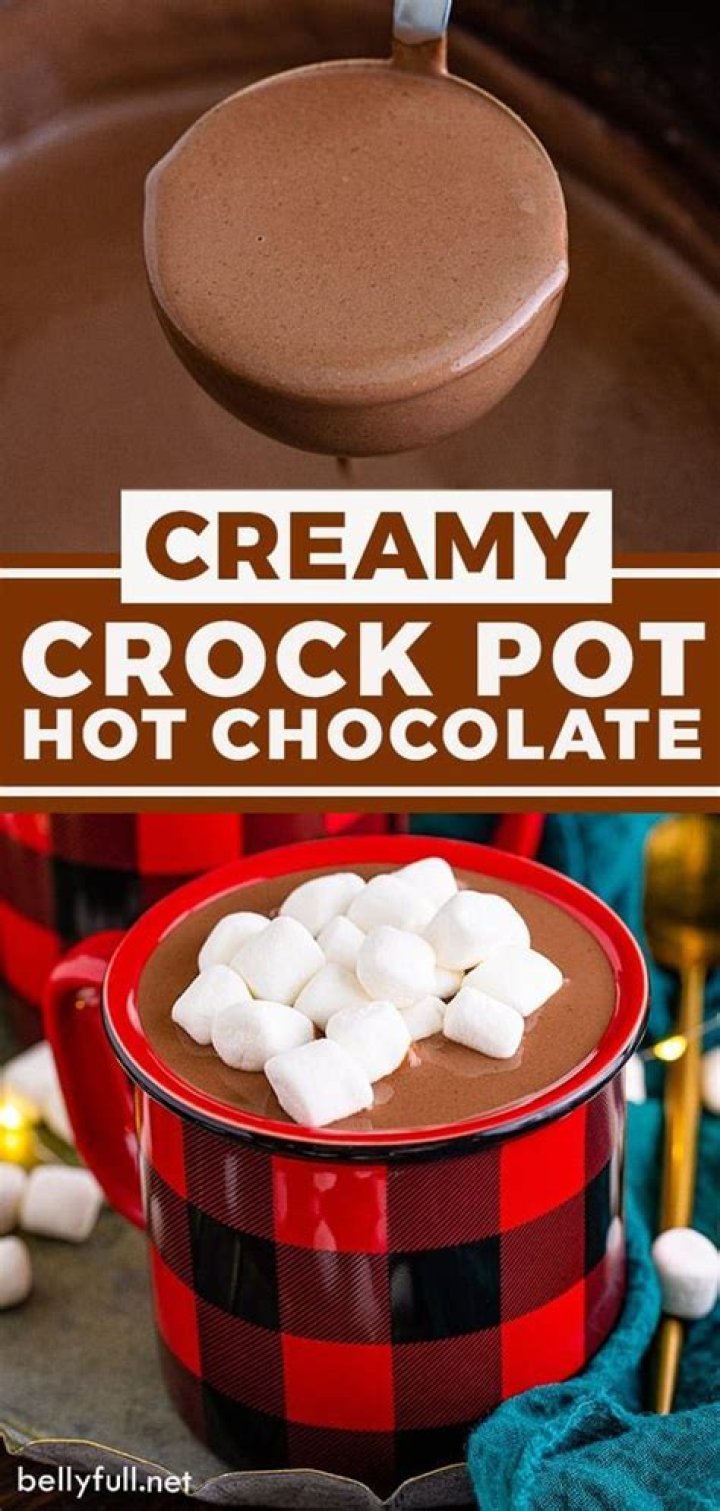 Hot chocolate in a crock pot topped with marshmallows.