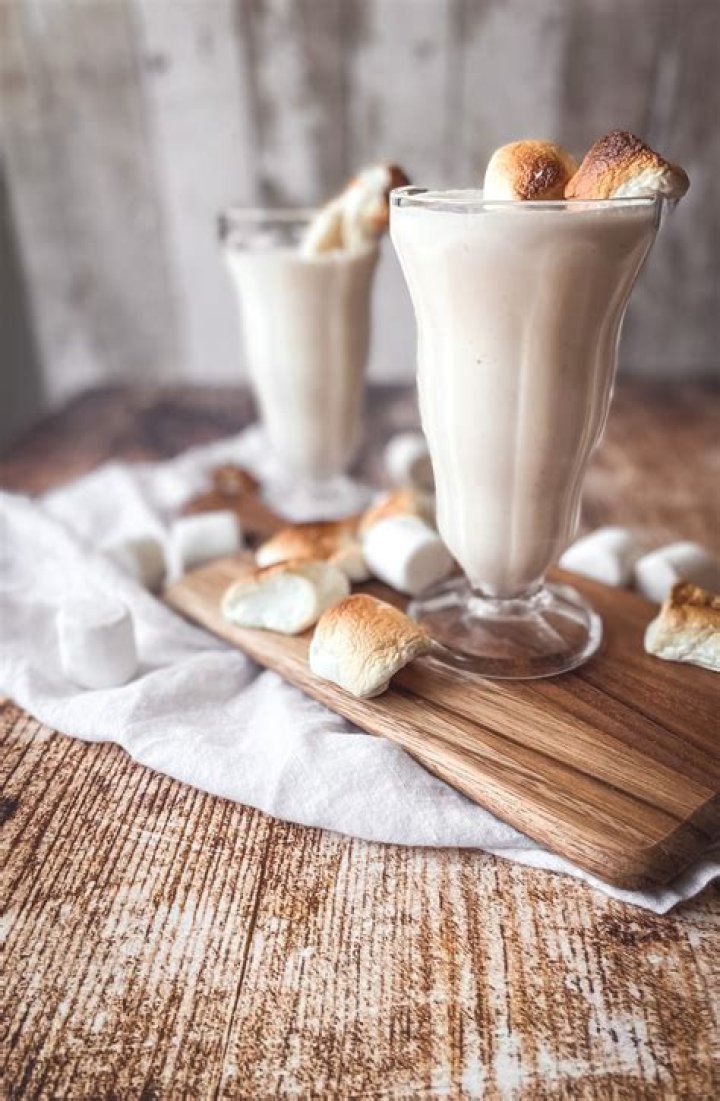Milkshake topped with toasted marshmallow and chocolate.