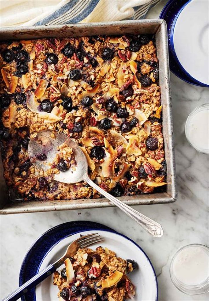 Stack of two baked oatmeal cups filled with chocolate chips.